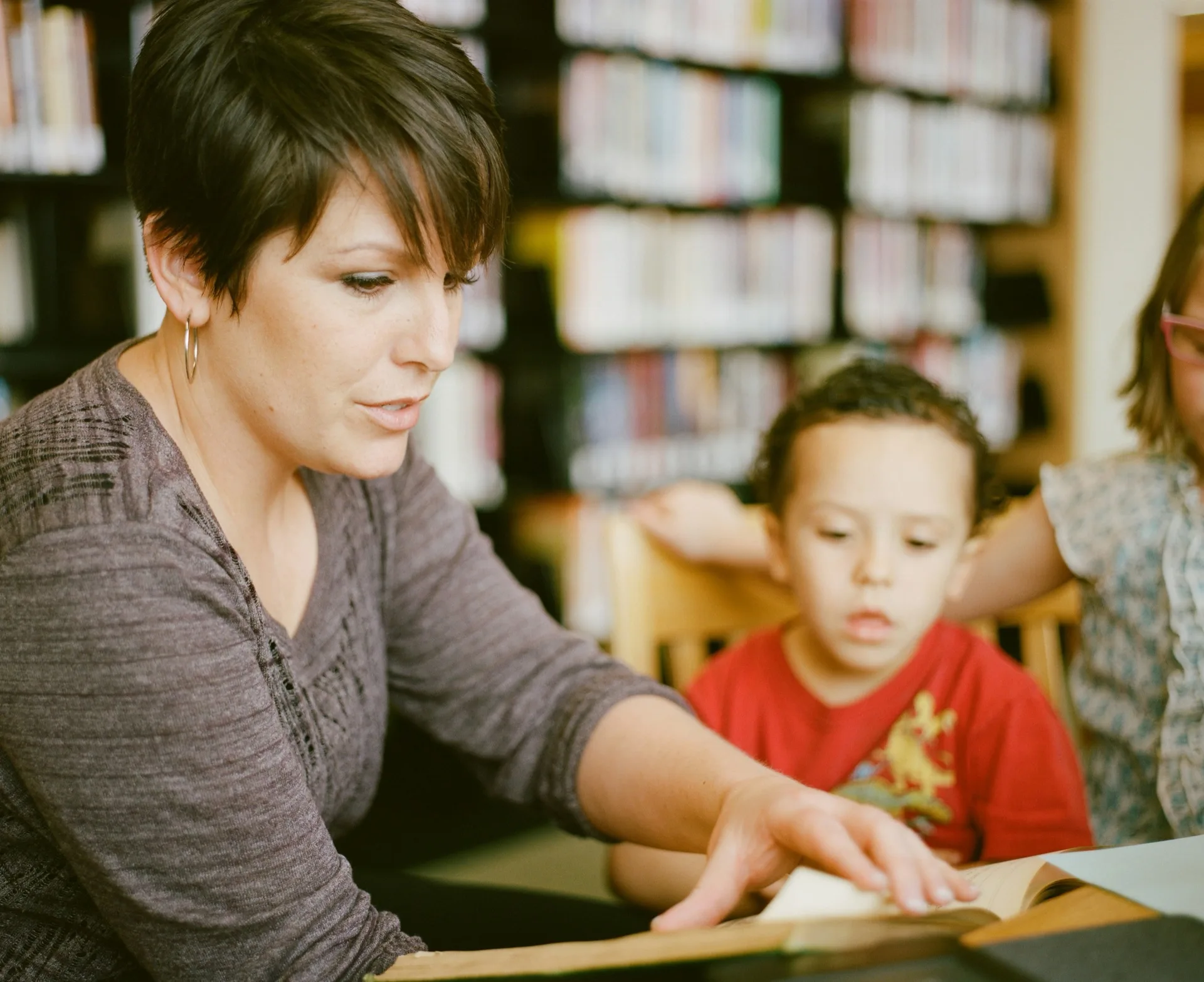 Teacher helping student